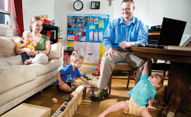 Dan Johnson GS; his wife, Julie; and their children Anders (5), Lucia (2), and Henrik (5 months) make good use of their small living room.