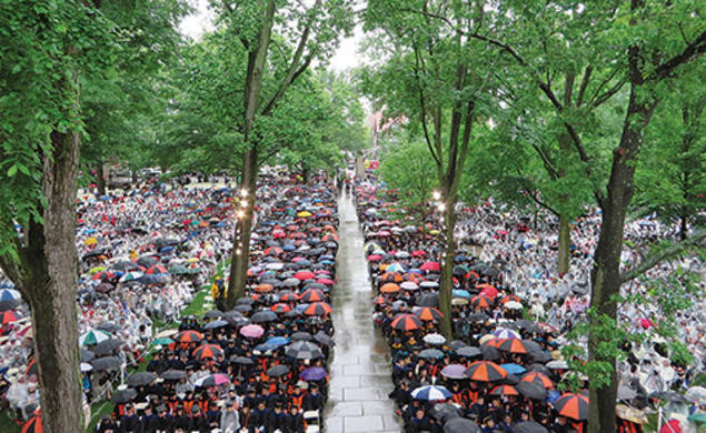 The front campus was filled with umbrellas and ponchos in this view of Commencement from Nassau Hall.