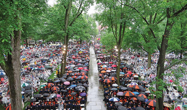 The front campus was filled with umbrellas and ponchos in this view of Commencement from Nassau Hall.