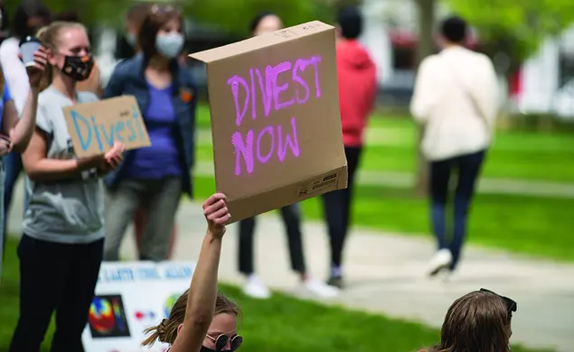 Protestors with Divest Signs