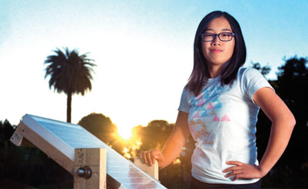 Eden Full ’15 displays a prototype of the SunSaluter in Oakland, Calif., in 2012.