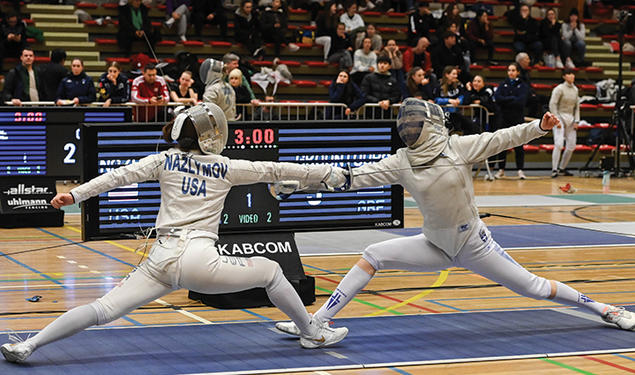 Two people fencing.