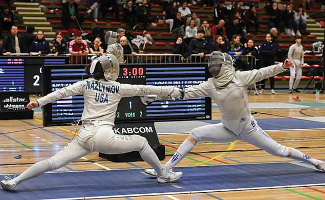 Two people fencing.