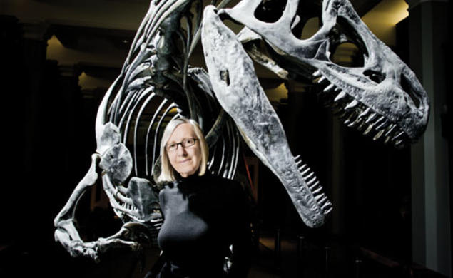 Gerta Keller in the atrium of Guyot Hall, with an Antrodemus dinosaur excavated during a 1941 dig.