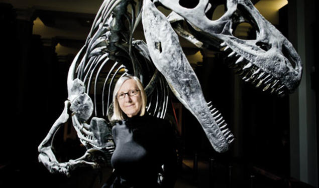 Gerta Keller in the atrium of Guyot Hall, with an Antrodemus dinosaur excavated during a 1941 dig.