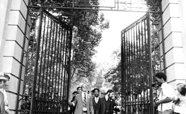  Class president Stewart Dill (now McBride), left, Hal Strelnick ’70, and Michael Calhoun ’70, behind, lead graduates through FitzRandolph Gate after their Commencement. Most ­seniors skipped the traditional Commence­ment gowns and wore armbands sym