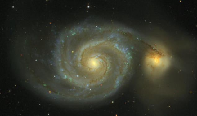 Messier 51, as observed in the Sloan Digital Sky Survey, is actually two galaxies in collision. The impact, which will take 100 million years to complete, creates the spiral arms and the spray of stars visible at the right. Known as the Whirlpool Galaxy, 