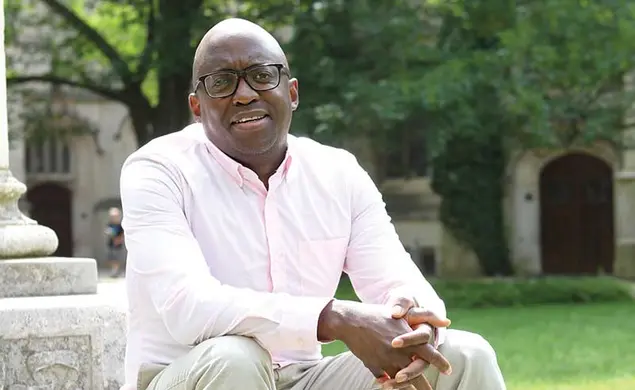 Jacob Dlamini sitting on steps on Princeton's campus.