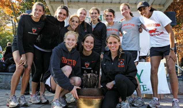 The women’s cross country team celebrates its 2009 Ivy Championship, the fourth for its seniors, in front row, from left, Reilly Kiernan, Alexa Glencer, and Liz Costello.