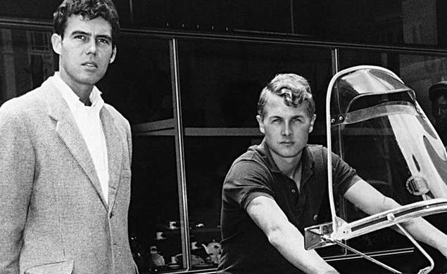 John Hopkins ’60 sits on a motorcycle to the right, while friend Joe McPhillips ’58 stands on the left in this black-and-white photo. The pair’s motorcycle journey through North Africa in the 1960s was the subject of Hopkins’ The White Nile Diaries. This image appeared on the cover of the book.