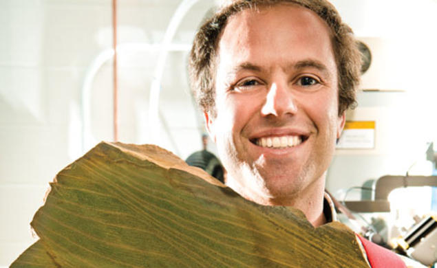 Adam Maloof prepares to grind a rock that records tidal cycles 640 million years ago.