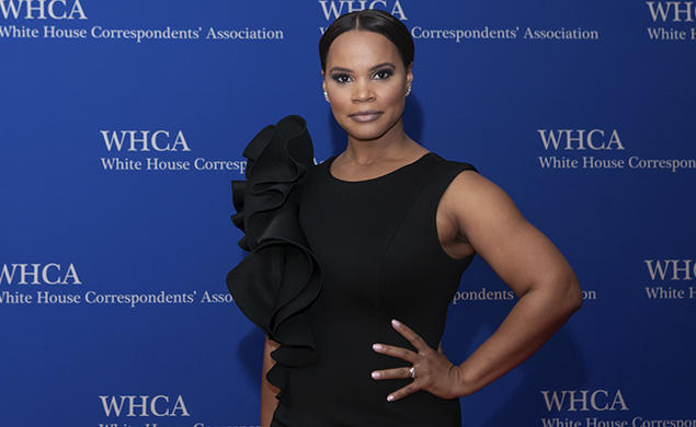 Laura Coates ’01 is photographed against a backdrop that reads "White House Correspondents’ Association."