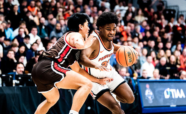 Dalen Davis ’27 drives to the basket against Brown. 