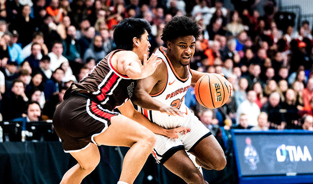 Dalen Davis ’27 drives to the basket against Brown. 