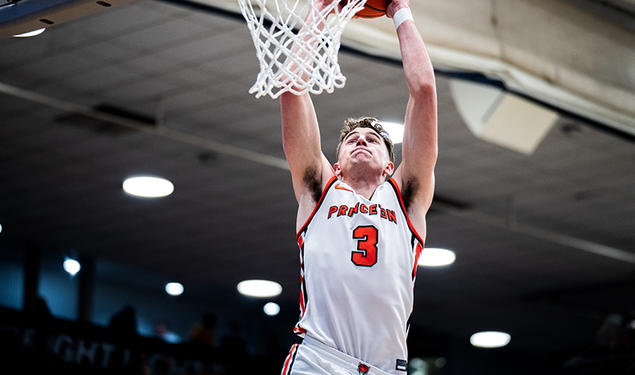 Caden Pierce ’26 rises for a dunk against Brown