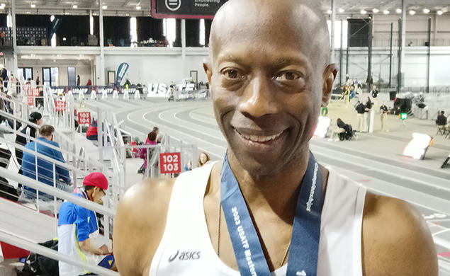 Bruce McBarnette in front of an indoor track