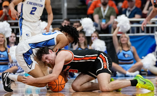 Creighton's Trey Alexander and Princeton's Ryan Langborg ’23 vie for a loose ball in the second half of Friday's Sweet 16 game.