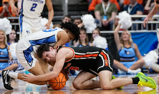 Creighton's Trey Alexander and Princeton's Ryan Langborg ’23 vie for a loose ball in the second half of Friday's Sweet 16 game.