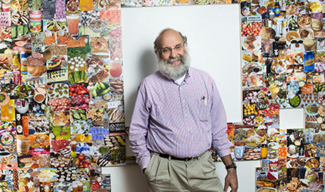 Dean of the Faculty David Dobkin with parts of the Lewis Center exhibition created from his collections.