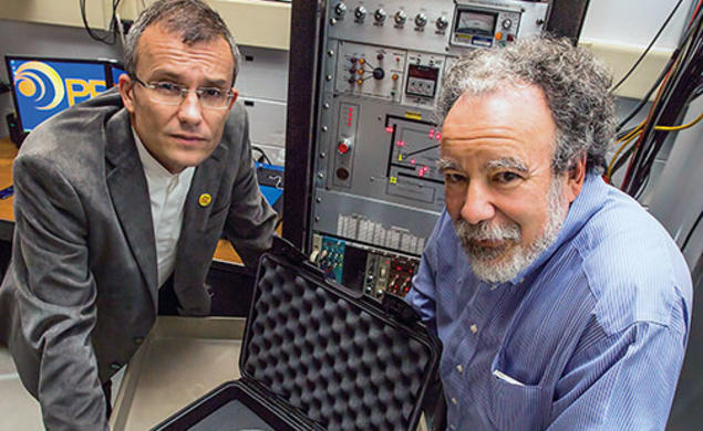 Alexander Glaser, left, and Robert Goldston with a stand-in for a warhead that will be used to test their system for verifying the presence of nuclear warheads.