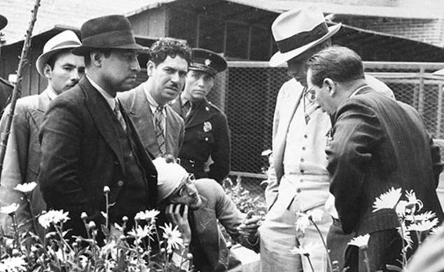 Ramón Mercader del Rio (in bandages), who murdered Marxist Leon Trostky, talks to investigators, in a photograph in Firestone Library’s Collection.