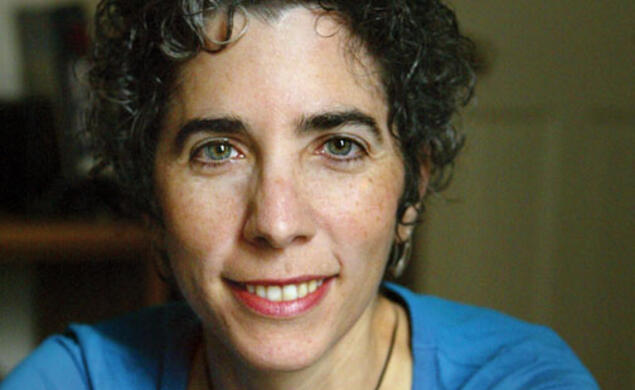 Moment139-REVISED.jpg A smiling woman's portrait.