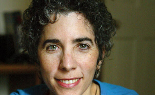 A smiling woman's portrait. 