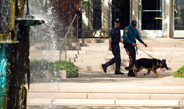 ﻿A search team outside Corwin Hall.