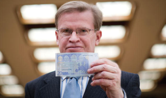 A new book by ­Professor Harold James, shown holding a 20-euro note, finds “a crucial flaw” in the creation of the European Monetary Union.