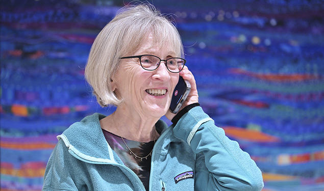 Harvard professor Claudia Goldin speaks to a reporter on the phone in her home in Cambridge, Massachusetts, after learning that she received the Nobel Prize in economics on Monday.