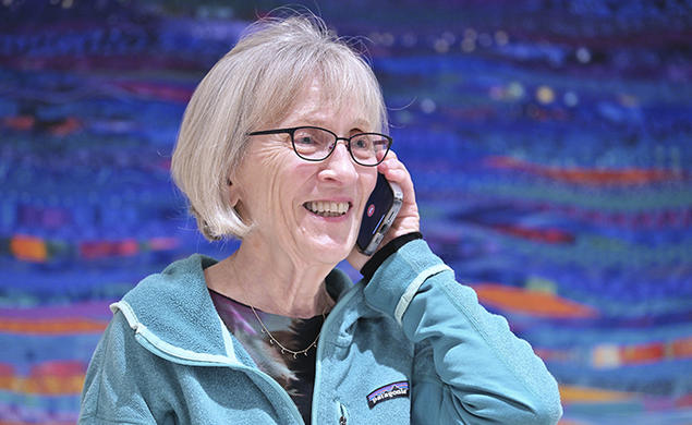 Harvard professor Claudia Goldin speaks to a reporter on the phone in her home in Cambridge, Massachusetts, after learning that she received the Nobel Prize in economics on Monday.