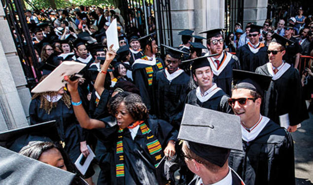 The Class of ’14 exits jubilantly through FitzRandolph Gate at the conclusion of Commencement.