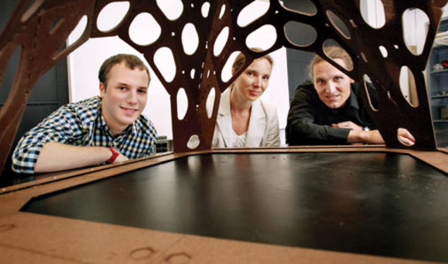 Admiring the chocolate pavilion created by Alex Jordan *13, left, are assistant professors Sigrid Adriaenssens and Axel Kilian.