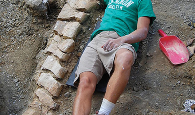 Evan Saitta ’14 at the site of a fossil dig in Montana.