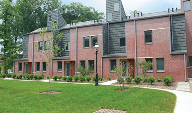 Lakeside’s townhouses feature brick and tile exteriors and landscaping.