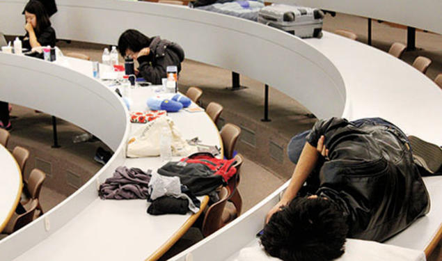 The “mental marathon” of HackPrinceton takes its toll Saturday night on students in a Friend Center lecture hall.