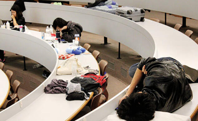 The “mental marathon” of HackPrinceton takes its toll Saturday night on students in a Friend Center lecture hall.