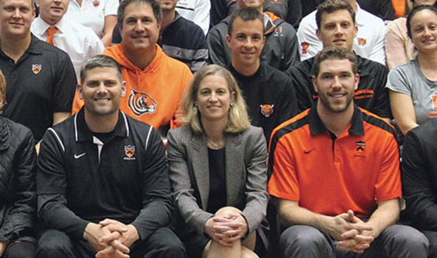 Mollie Marcoux ’91, front row center, poses with coaches and athletics department staffers.