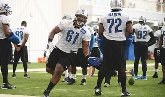 Caraun Reid ’14 (61) runs a drill with the Detroit Lions.