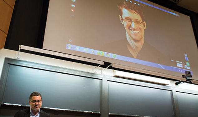 Journalist Bart Gellman ’82, left, talks with Edward Snowden via video link.