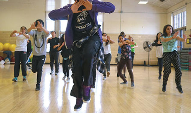 Don Wilson ’15, of the Black Arts Company: Dance, leads students in a hip-hop routine.