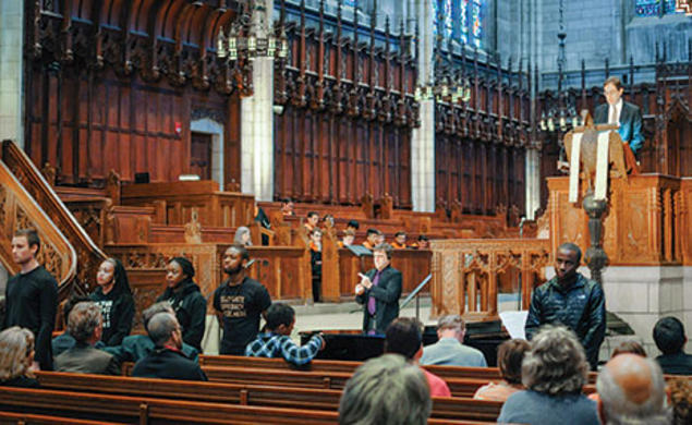 Students turn their backs to President Eisgruber ’83 as he speaks in the Chapel April 12.