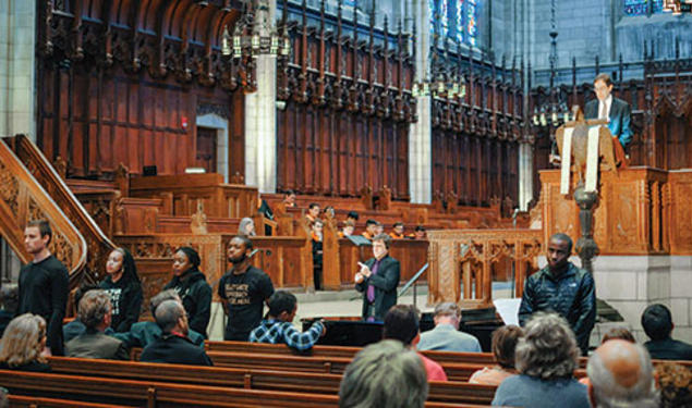 Students turn their backs to President Eisgruber ’83 as he speaks in the Chapel April 12.