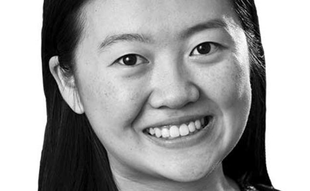 This is a black-and-white headshot photo of Allison Tang.