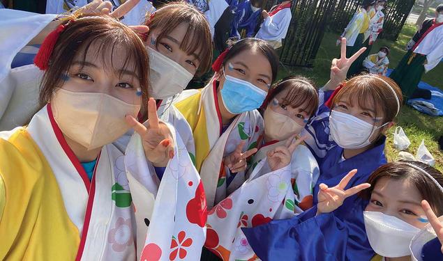 Anne Wen ’23, at center in blue mask, attends a traditional Japanese festival in Osaka, Japan