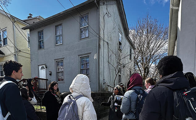 Fern Spruill, center, leads students on a walking tour