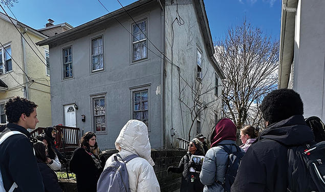 Fern Spruill, center, leads students on a walking tour