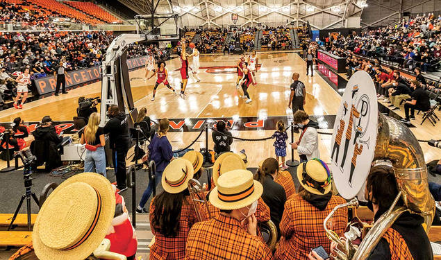 This is a photo of Princeton playing Harvard in men's basketball, with the marching band's backs to the camera.