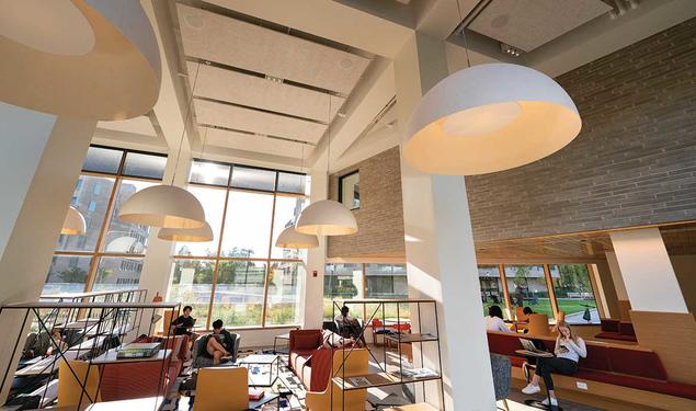 An airy Fu Hall common space faces the courtyard between the colleges.