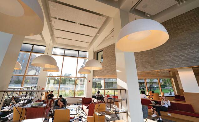 An airy Fu Hall common space faces the courtyard between the colleges.